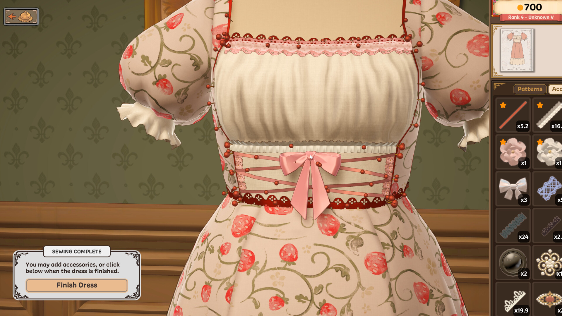 The Dressmaker decoration stage: lace and a bow placed on the finished dress